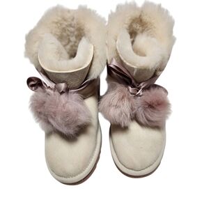 Cozy Ugg Shearling Boots with Pink Pom Poms